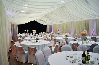 Cricklade Town Hall transformed using wall and ceiling drapes, as well as chair and table decor