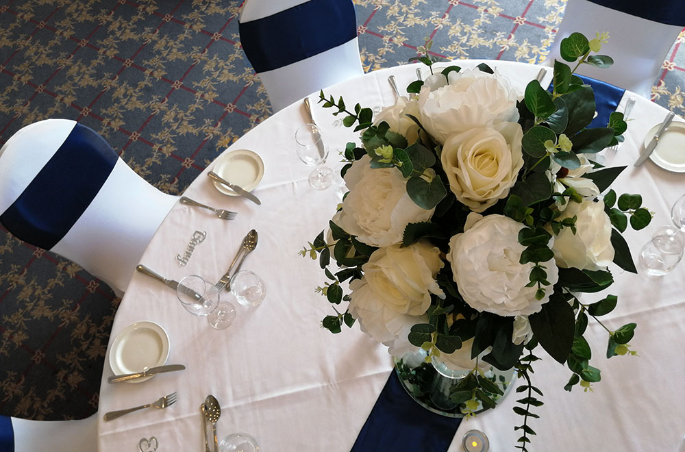 Wedding Breakfast table set up at the Wrag barn Golf Club in Highworth, Swindon. With large table centrepiece